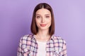 Portrait of attractive cheery content brown-haired girl wearing checked shirt isolated over purple violet color