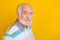 Portrait of attractive cheery friendly middle aged grey haired man copy space isolated over vivid yellow color Royalty Free Stock Photo