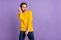 Portrait of attractive cheery funky cool man dancing moving relax isolated over pastel violet purple color background