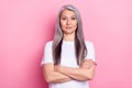 Portrait of attractive content grey-haired woman folded arms isolated over pink pastel color background Royalty Free Stock Photo
