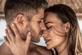 Portrait of attractive couple in love embracing each other. Closeup photo of young beautiful people hugging and kissing. Romantic Royalty Free Stock Photo