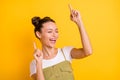 Portrait of attractive dreamy cheerful girl dancing having fun rest chill out isolated over bright yellow color