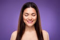 Portrait of attractive dreamy cheerful woman perfect clear pure make-up tone skin isolated over bright violet purple Royalty Free Stock Photo