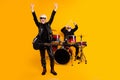 Portrait of attractive elderly cheerful grey-haired couple performing hit genre having fun fame showing horn sign Royalty Free Stock Photo