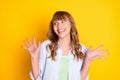 Portrait of attractive funny cheerful girl having fun good mood great news isolated over bright yellow color background Royalty Free Stock Photo