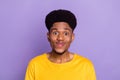 Portrait of attractive funny shy modest cheerful guy candid smile isolated over violet purple color background