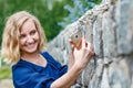 Portrait attractive girl with blond hair in a park Royalty Free Stock Photo