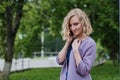 Portrait attractive girl with blond hair in a park Royalty Free Stock Photo