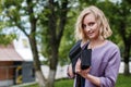 Portrait attractive girl with blond hair in a park Royalty Free Stock Photo