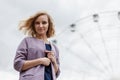 Portrait attractive girl with blond hair in a park Royalty Free Stock Photo