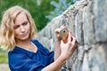 Portrait attractive girl with blond hair in a park Royalty Free Stock Photo