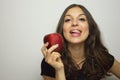 Portrait of attractive girl smiling with red apple in her hand healthy fruit Royalty Free Stock Photo