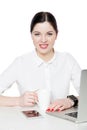 Portrait of attractive happy successful brunette businesswoman with makeup in white shirt sitting, looking at camera with toothy Royalty Free Stock Photo