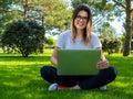 Portrait of attractive happy woman with laptop outdoors. Online education Royalty Free Stock Photo