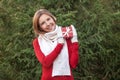 Portrait of attractive happy young woman with Christmas gift box in her hands Royalty Free Stock Photo