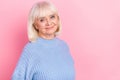 Portrait of attractive kind nice cheery grey-haired woman wearing pullover copy space isolated over pink pastel color