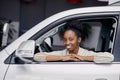 Portrait of attractive lady in car