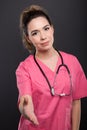 Portrait of attractive lady doctor offering hand shake Royalty Free Stock Photo
