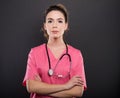 Portrait of attractive lady doctor posing with arms crossed Royalty Free Stock Photo