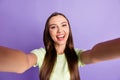 Portrait of attractive lady taking selfie photo toothy smile wear light green isolated on purple color background