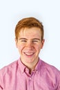 Portrait of attractive laughing smiling boy on white