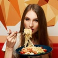 Attractive woman eating seafood pasta Royalty Free Stock Photo