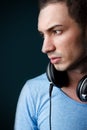 Portrait of attractive male deejay with headphones