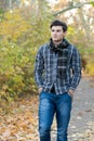 Portrait of attractive man, have a rest oudoor in autumn park Royalty Free Stock Photo
