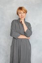 Portrait of attractive mature woman 60 years old. Pretty senior lady in gray dress Royalty Free Stock Photo