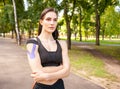 Fit woman with kinesiological taping posing outdoors. Royalty Free Stock Photo