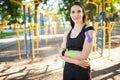 Fit woman with kinesiological taping posing outdoors. Royalty Free Stock Photo