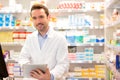 Portrait of an attractive pharmacist at work