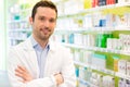 Portrait of an attractive pharmacist at work