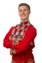 Portrait of the attractive russian guy in red folk costume isolated on white