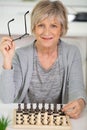 portrait attractive senior woman playing chess Royalty Free Stock Photo