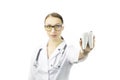 Portrait of sexy female dentist holding tooth model. Yellow glasses. Face blur Royalty Free Stock Photo
