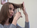 Woman holding hairdresser scissors and hair comb. Royalty Free Stock Photo