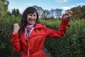 Attractive smiling delighted woman with raise fists holding up a set of keys belonging to her house or car in her hand Royalty Free Stock Photo