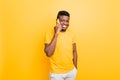 Portrait of an attractive smiling trendy young african american man looking at camera, empty copy space, isolated over Royalty Free Stock Photo