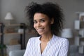 Portrait of attractive smiling young afro american female at home Royalty Free Stock Photo