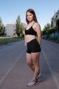 Portrait of attractive sport woman in sportswear posing outdoors at the stadium Royalty Free Stock Photo
