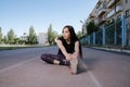 Portrait of attractive sport woman in sportswear posing outdoors at the stadium Royalty Free Stock Photo