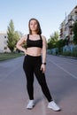 Portrait of attractive sport woman in sportswear posing outdoors at the stadium Royalty Free Stock Photo