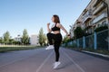 Portrait of attractive sport woman in sportswear posing outdoors at the stadium Royalty Free Stock Photo