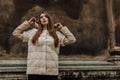 Portrait of attractive stylish woman in fur against grey background Royalty Free Stock Photo