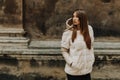 Portrait of attractive stylish woman in fur against grey background Royalty Free Stock Photo