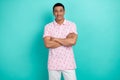 Portrait of attractive successful young man crossed arms posing isolated on turquoise color background Royalty Free Stock Photo