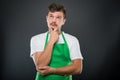 Portrait of attractive supermarket employer posing like thinking Royalty Free Stock Photo