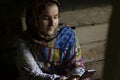 Portrait of an attractive teenage Muslim girl working with smart phone Royalty Free Stock Photo