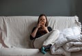 Portrait of an attractive thirty year old girl on her couch in the morning Royalty Free Stock Photo